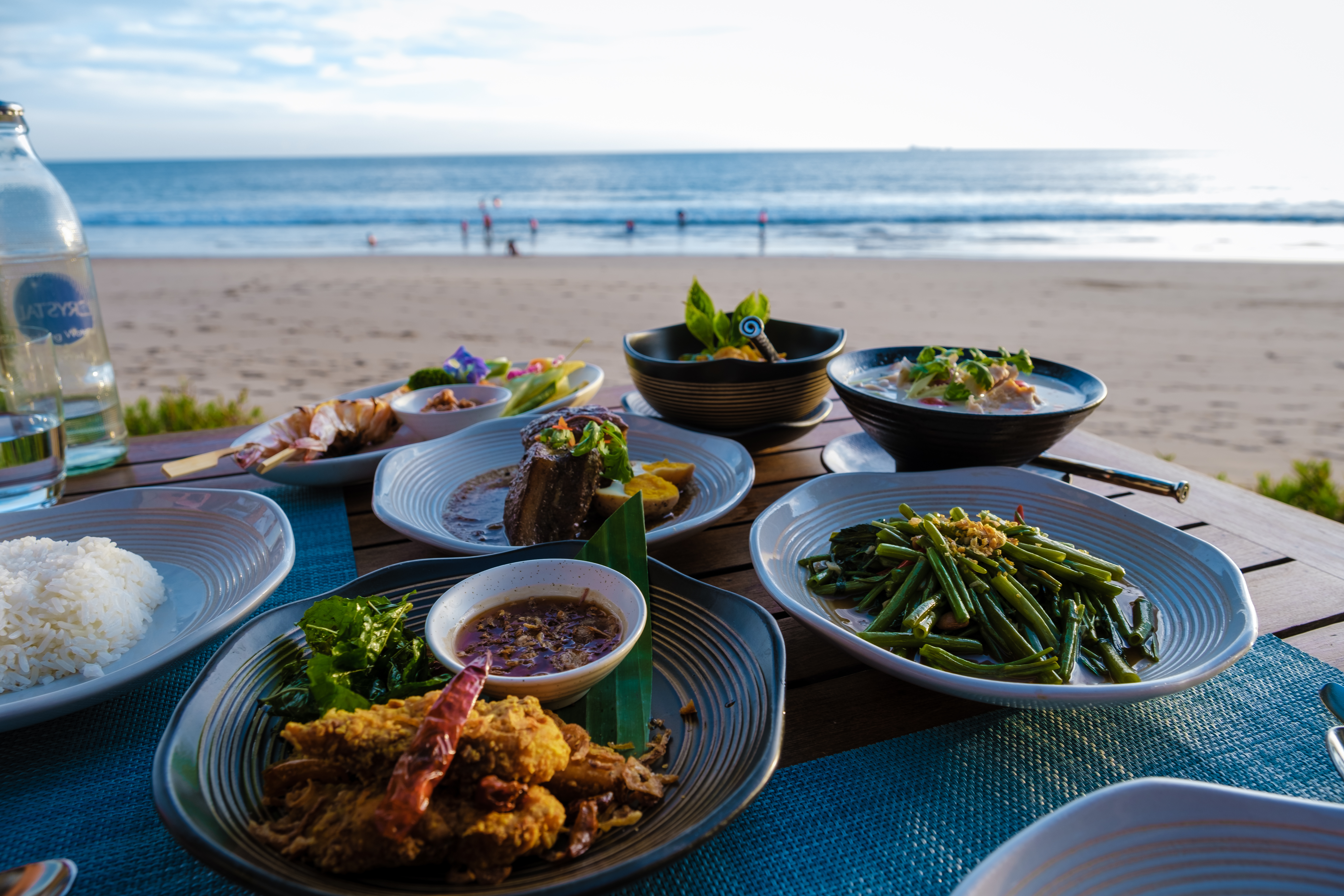 table of food on a beach in Thailand